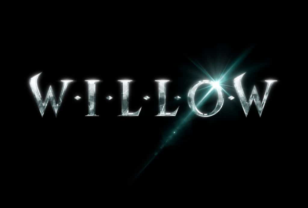 The word "WILLOW" gleams in metallic letters against a dramatic black backdrop, with a magical flare shining from the "O"—bringing the fantasy and adventure of Disney+’s Willow universe to life for fans immersed in the enchantment of Disney entertainment.
