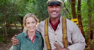 Guests share a joyful moment beneath lush greenery and golden sunlight, embodying the excitement of Disney’s Jungle Cruise adventure.