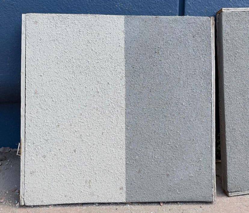 A vertically split concrete square, with one half light and the other dark, showcases the sleek, innovative style that Disney Imagineers brought to EPCOT’s Creations Shop—perfectly reflecting the park’s modern aesthetic.