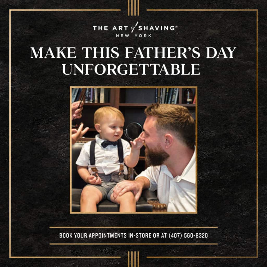 A father and son, both dressed up and beaming, share a fun moment together inside the Father & Son Barber Shop at Disney Springs during Disney’s Father’s Day celebration.