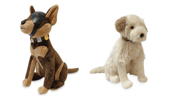 Wink and Buddy Plushes—beloved Pals from Universal Studios, one sporting a soft brown coat with a signature black mask and the other fluffy white—sit together against a crisp white backdrop, all set to charm guests with their signature theme park outfits.