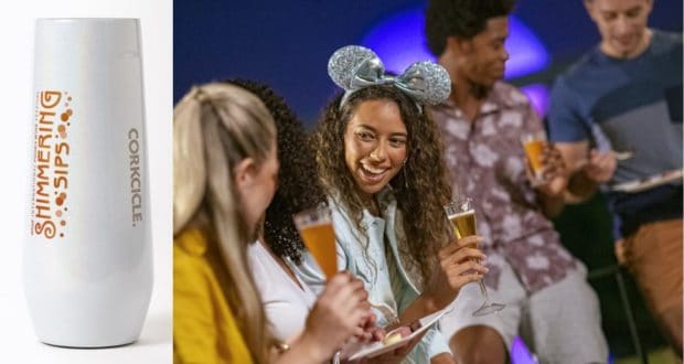 A group of friends laugh and sip specialty drinks at EPCOT’s International Food & Wine Festival, with a signature silver Corkcicle tumbler from the festival’s Presenting Sponsor displayed on the table.