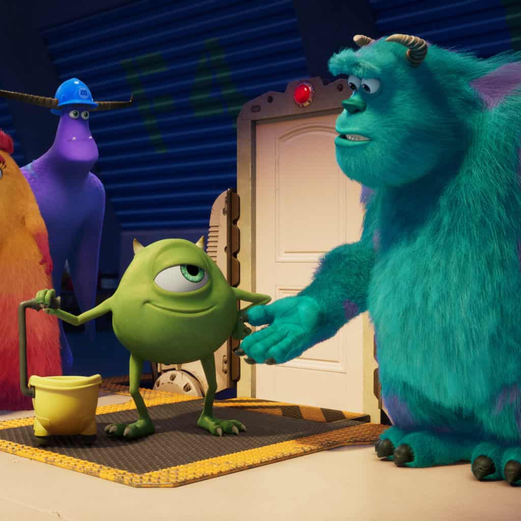 Mike Wazowski, holding a mop and bucket, stands alongside Sulley, who gestures animatedly, with two other monsters nearby in a scene inspired by the workplace antics of Monsters at Work—perfect for fans of Pixar’s hit attraction and entertainment experiences.