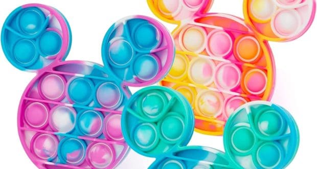 Three vibrant, Mickey Mouse-shaped tie-dye bubble push toys in pink, yellow, and blue are lined up on a crisp white surface—adding a playful touch of Disney magic that’s perfect for fans looking to bring home a bit of theme park fidgeting fun, now available on Amazon.