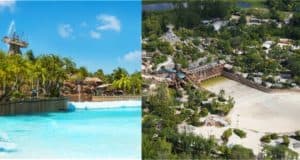 Typhoon Lagoon’s signature tropical wave pool surrounded by swaying palm trees, with an aerial view revealing the expansive Disney Water Park attractions to the right.