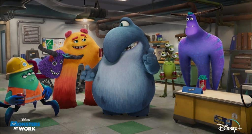 The Monsters at Work crew gathers in their animated office, sharing laughs and playful conversation just like guests might encounter during a themed attraction or character experience, with the show’s vibrant logo and Disney+ branding in view to highlight the fun workplace adventure tied to Disney entertainment.