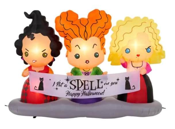 Step into Halloween magic as you spot three playful cartoon witches from Hocus Pocus displaying an “I put a spell on you! Happy Halloween!” banner adorned with black cats—an eye-catching inflatable centerpiece perfect for immersive seasonal décor at your favorite entertainment venue.