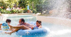 A family getting wet in a tube at Disney's Blizzard Beach Water Park.