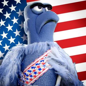 Sam Eagle stands front and center in a patriotic pose before the American flag, his blue feathers complemented by a proud sash. With a solemn expression, he perfectly embodies the spirit of Independence Day, making this scene ideal for Fourth of July festivities at Disney parks.