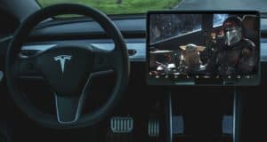 Tesla cabin showcasing its dashboard screen streaming The Mandalorian with Baby Yoda, thanks to the latest Tesla update adding Disney+—turning every drive into a theme park-style entertainment adventure for fans of Disney and Star Wars.