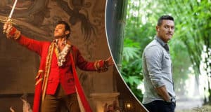 Luke Evans dressed as his swashbuckling character from Disney+’s Pinocchio, complete with a red costume and sword, alongside a casual look where he enjoys the greenery outside the set.
