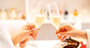 Guests raise champagne glasses in a lively, festive scene at Margaritaville Resort Orlando, celebrating relaxation and exclusive St. Somewhere Spa deals as part of the ultimate resort experience near Orlando’s top theme parks.