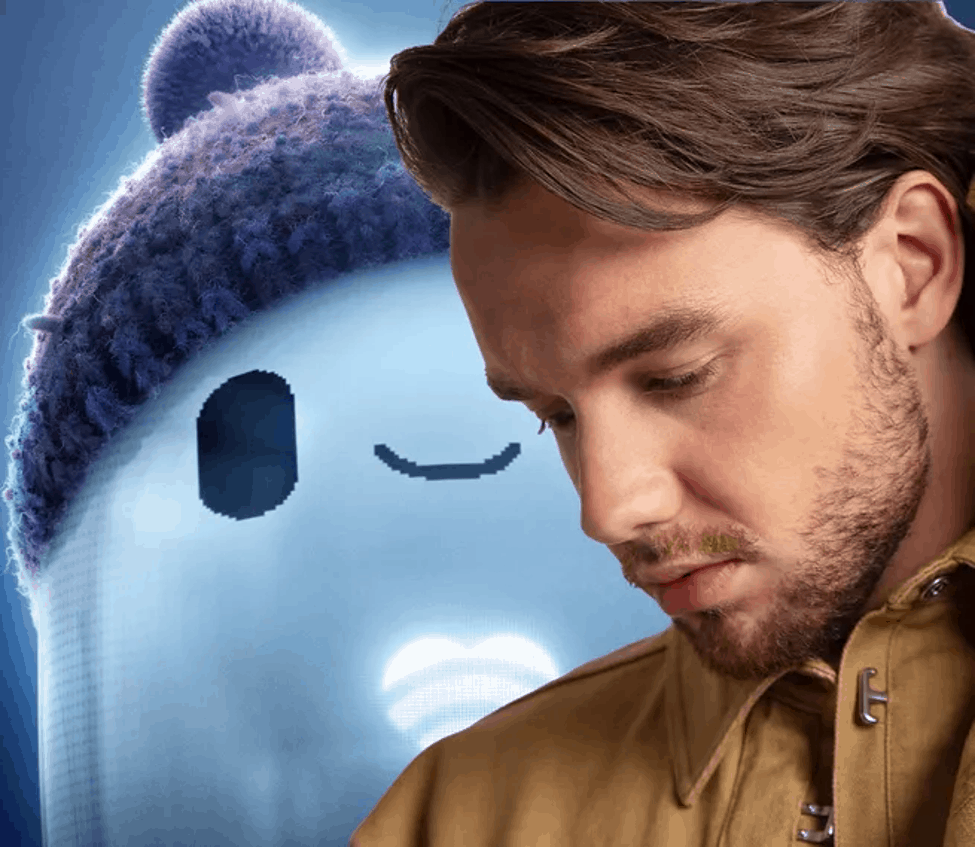 A guest stands thoughtfully beside a cheerful blue cartoon character wearing a beanie, capturing the playful spirit of Ron's Gone Wrong at an entertainment venue.