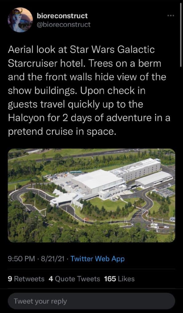 Aerial view of the Star Wars: Galactic Starcruiser hotel at Walt Disney World, highlighting the immersive starship design set amidst lush landscaping and winding resort roads.