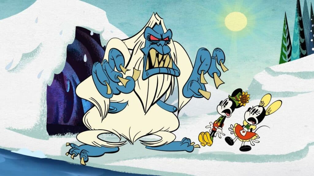 A playful yeti startles Mickey and Minnie Mouse in front of a frosty cave beneath blue skies, capturing the lively spirit and snowy fun of Disney Wish's AquaMouse attraction on Disney Cruise Line.