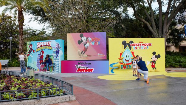Three vibrant Disney Junior backdrops featuring Spidey and Mickey Mouse bring the excitement of Disney Springs to life, creating perfect photo ops for fans exploring the entertainment district.