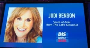 A large display at DIS Family Reunion 2021 features Jodi Benson’s photo alongside text about her legendary performance as Ariel in The Little Mermaid, celebrating fan-favorite highlights from the Jodi Benson Panel.