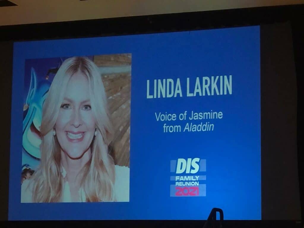 Linda Larkin, the voice behind Princess Jasmine in Disney’s Aladdin, appears onscreen addressing fans during a special panel at DIS Family Reunion 2021.
