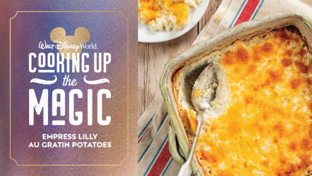 Golden, cheesy au gratin potatoes served in a casserole dish with a spoon, placed beside a "Cooking Up the Magic" sign—bringing Disney Parks magic to your kitchen with every creamy bite.