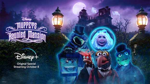 The Muppets, dressed in Halloween costumes, pose in front of a haunted mansion at night inside Disney's Hollywood Studios. On the left, the Disney+ logo and "Muppets Haunted Mansion Pre-Show" title set the scene for a spooktacular entertainment experience.