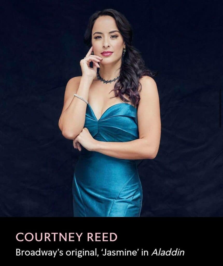 Courtney Reed, Broadway’s original Jasmine from Aladdin, dazzles in a teal dress against a dramatic backdrop. The image celebrates her enchanting stage presence with Disney Princess – The Concert, thrilling fans of Disney entertainment and magical theatrical experiences.