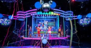 Mickey, Minnie, and their friends light up the stage with energetic dance moves, surrounded by vibrant balloons, sparkling streamers, and shining disco balls during the Disney Junior Dance Party at Disney California Adventure. Experience the excitement when the party begins October 15!.