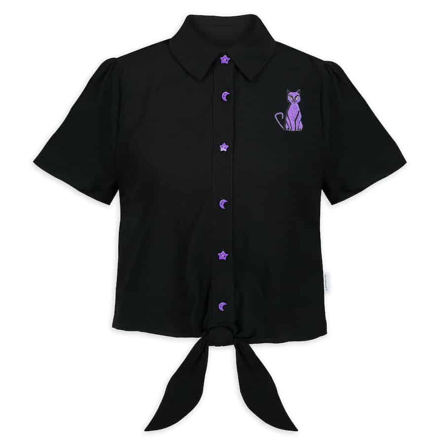Hocus Pocus-inspired black short-sleeve shirt featuring a purple cat patch, playful purple buttons, and a front tie at the hem—ideal for showing off your fandom during Halloween events or magical nights at Disney parks. Part of the exclusive Hocus Pocus merchandise collection.