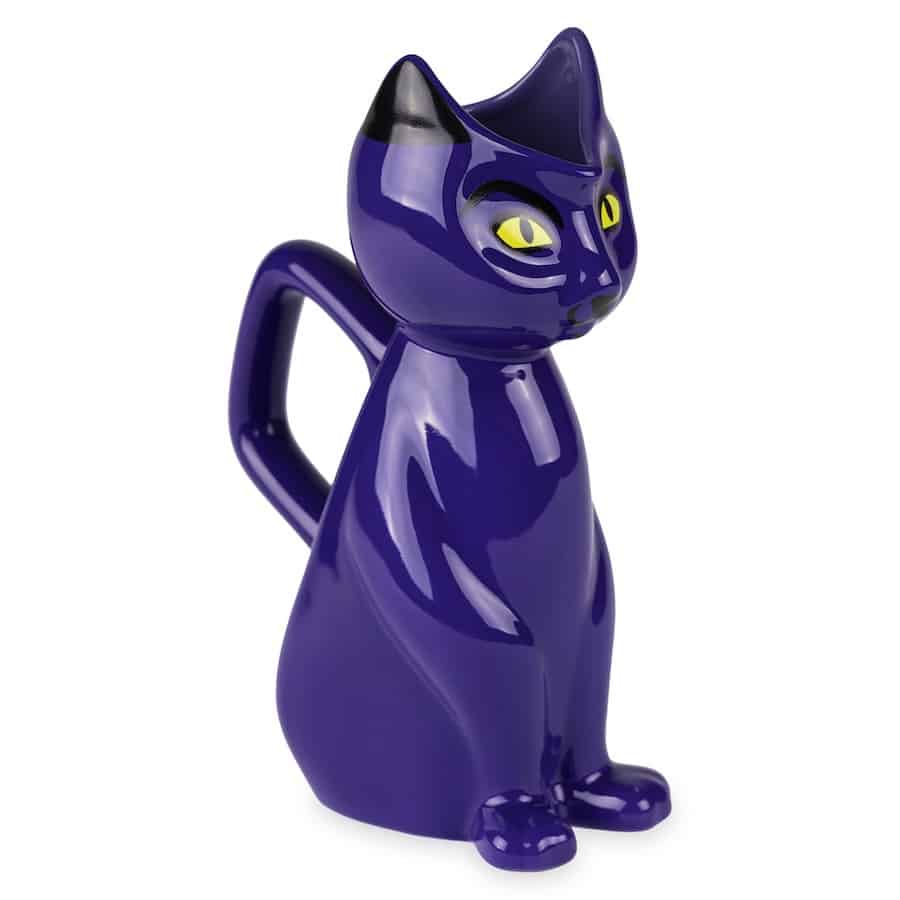 Whimsical purple ceramic cat-shaped pitcher with striking yellow eyes, pointy upright ears, and a handle designed as the cat’s tail—an enchanting collectible for Hocus Pocus fans visiting Disney parks who want to bring home a bit of movie magic from their theme park adventure.