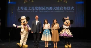 Mickey and Minnie Mouse take center stage with fellow Disney friends and Shanghai Disney Resort Ambassadors during a special event, creating a magical moment for fans.