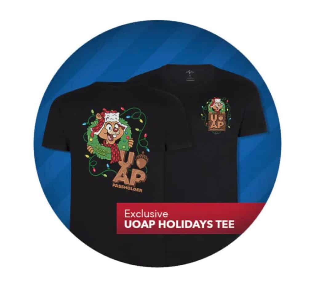 Festive black shirt showcasing a Universal Orlando holiday cartoon character with twinkling lights and bold "UOAP Passholder" lettering—perfect for Annual Passholders to celebrate the season and flaunt their exclusive perks at Universal Studios Orlando.