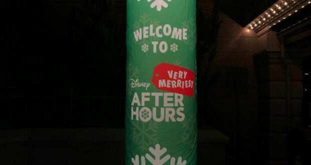A festive green sign at Magic Kingdom announces "Welcome to Disney Very Merriest After Hours," sparkling with snowflakes and twinkling lights, setting the scene for an enchanting holiday celebration at Walt Disney World.
