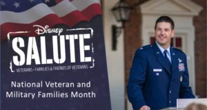 A member of the U.S. military stands at a podium beside a Disney Salute sign during Veterans and Military Families Month festivities, celebrating military heritage at Walt Disney World.
