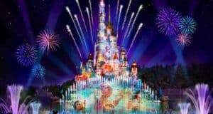 Spectacular fireworks and vibrant fountains illuminate the iconic Disneyland castle, with beloved Disney characters projected onto its walls during a dazzling nighttime show at Hong Kong Disneyland, which is currently temporarily closed.