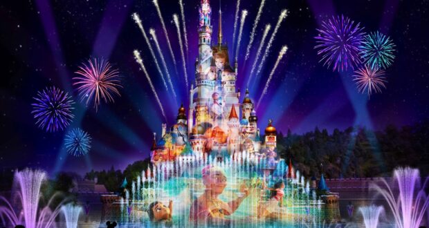 Spectacular fireworks and vibrant fountains illuminate the iconic Disneyland castle, with beloved Disney characters projected onto its walls during a dazzling nighttime show at Hong Kong Disneyland, which is currently temporarily closed.