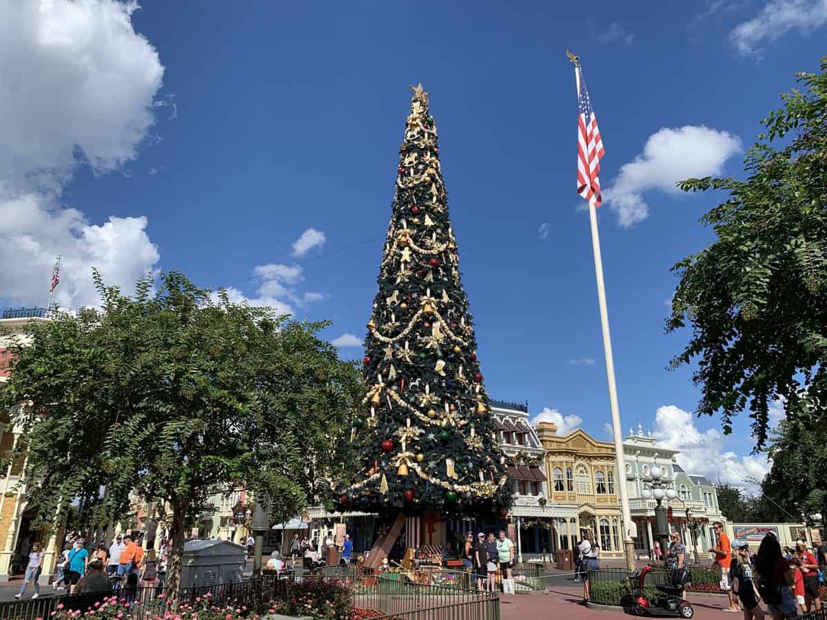 The American flag at Magic Kingdom with the Christmas Tree