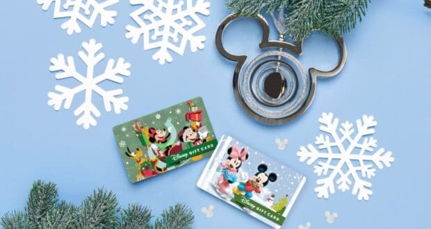 Disney gift cards featuring Mickey Mouse and friends surrounded by festive snowflakes, holiday pine branches, and a Mickey-shaped cookie cutter—perfect for magical experiences at Disney parks.