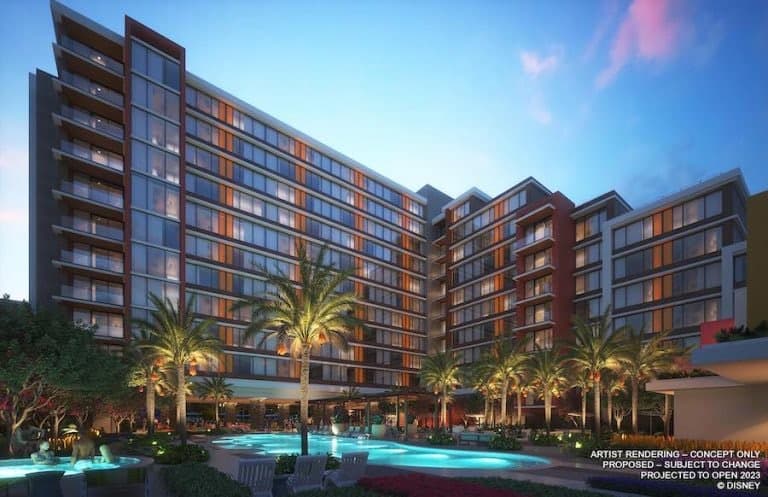 A vibrant, multi-story Disney World resort with a sparkling pool, swaying palm trees, and twinkling lights at sunset—an inviting retreat after an action-packed day in the parks. This resort is a top choice for guests planning their magical Disney adventure.