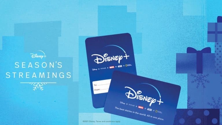 Disney+ gift cards featuring festive "Season's Streamings" text, surrounded by colorful wrapped presents, set against a blue backdrop reminiscent of Disney Park holiday celebrations.