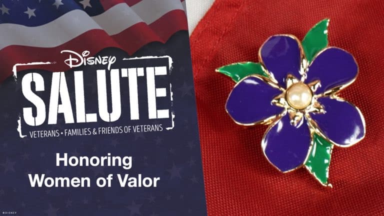 Disney Salute display featuring the message "Honoring Women of Valor" alongside a vibrant purple flower pin, all set against a bold red backdrop.