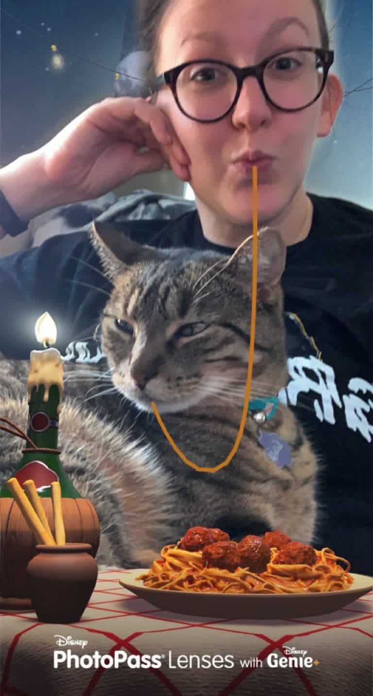 A woman and her cat recreate an iconic spaghetti-sharing moment at a whimsical Disney-inspired dining experience, complete with candlelight and a magical filter reminiscent of Genie+, evoking the enchanting atmosphere of a fairy tale world from your favorite animated films.