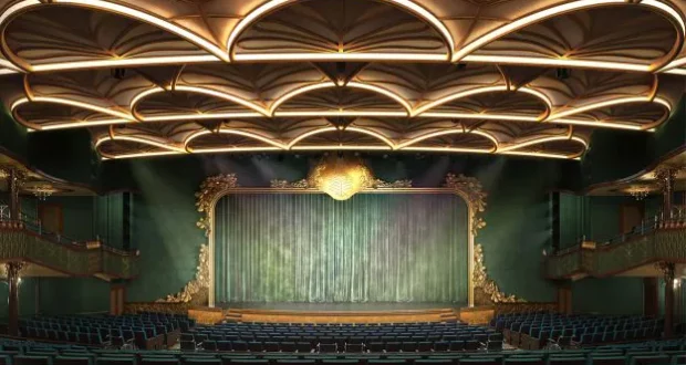 Majestic theater with an intricate ceiling, lush green curtain framing the stage, and rows of blue seats awaiting Guests—an immersive venue designed for unforgettable Disney Wish performances like the live, spectacular The Little Mermaid.