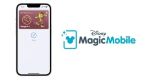 A smartphone screen shows a Disney MagicMobile pass, showcasing the seamless entry and digital convenience of Disney park admission, with the MagicMobile logo displayed alongside.