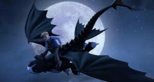 A young adventurer soars atop Toothless the Night Fury, flying past a glowing full moon above Berk, set against a dramatic night sky with scattered clouds.