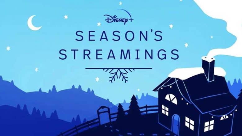 A whimsical, snow-dusted cabin illuminated under a night sky with "Disney+ Season’s Streamings" sparkling overhead, set in a magical blue-toned landscape reminiscent of Main Street, U.S.A. during the holidays, inviting guests to experience the Disney+ Holiday Collection—just like stepping into a winter wonderland at Disneyland or Walt Disney World.