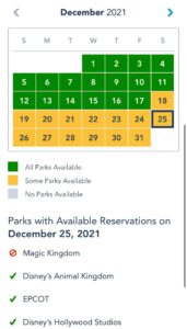 December 2021 calendar displaying Walt Disney World park reservation availability for Christmas Day, December 25.