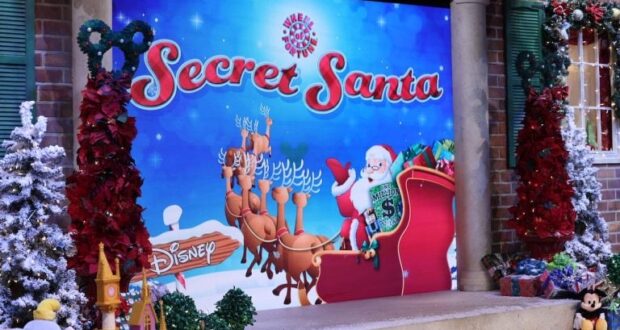 Santa rides his sleigh led by reindeer across a festive "Secret Santa" Disney backdrop, surrounded by sparkling holiday decorations, capturing the magic of Disney’s seasonal celebrations.