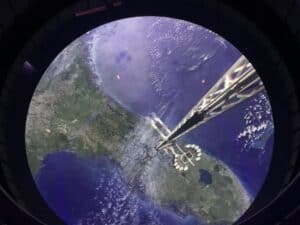 Earth as seen from space with a sleek, futuristic space elevator reaching toward the planet, capturing the awe-inspiring atmosphere of EPCOT’s Space 220 Lounge—an out-of-this-world dining adventure where advance reservations are a must.