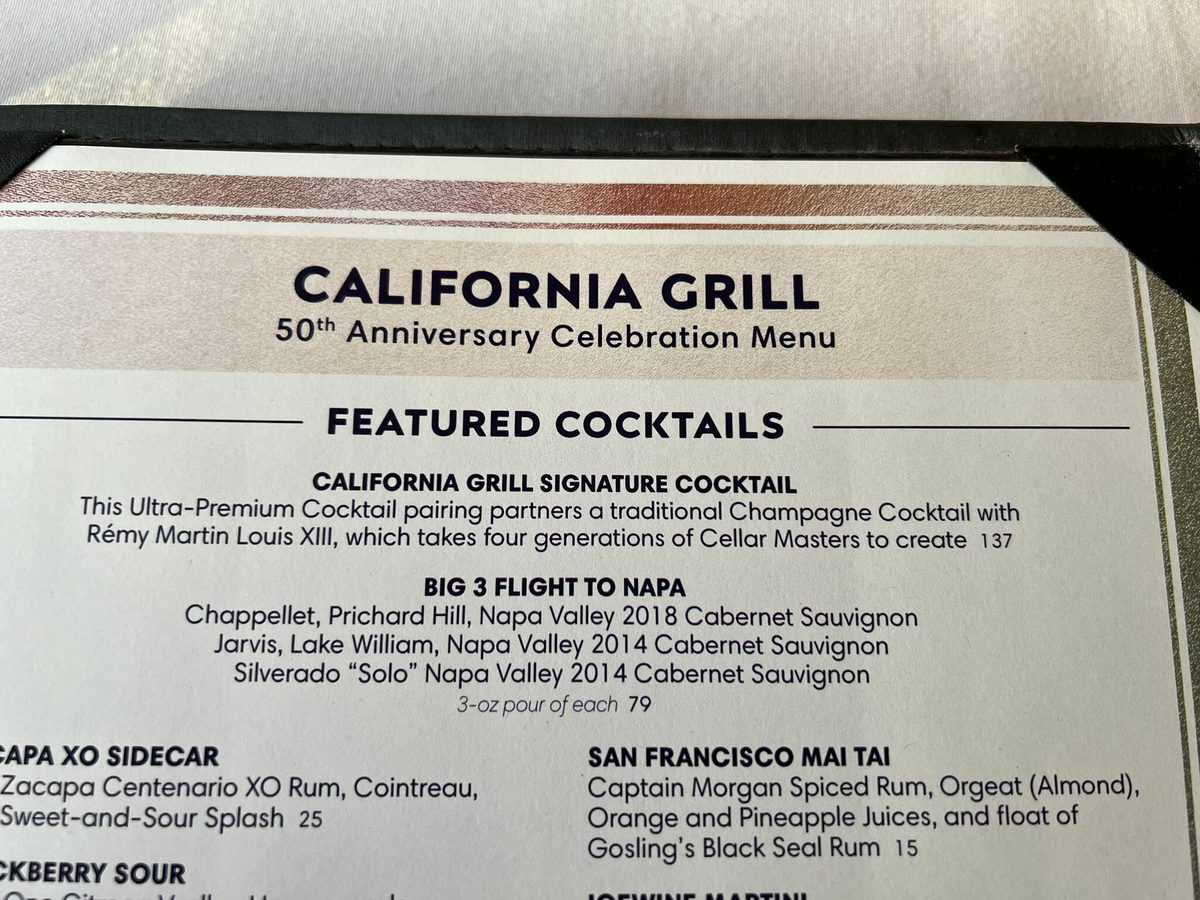 California Grill menu filled with eye-catching featured cocktails for Disney World guests, including an exclusive $137 signature drink, a classic Champagne Cocktail, and a special Napa wine flight—perfect for fans looking to elevate their magical dining experience.