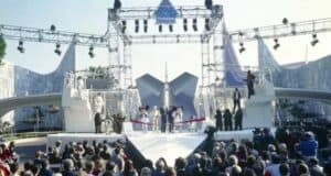 Fans gather at Disneyland’s Star Tours 35th Anniversary opening ceremony, where beloved Disney characters take the stage to celebrate alongside an excited crowd.