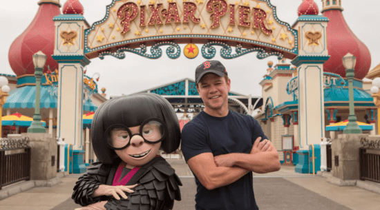 Edna Mode greets a guest with a striking resemblance to Matt Damon at the Pixar Pier entrance, creating a fun photo op at Disney California Adventure.